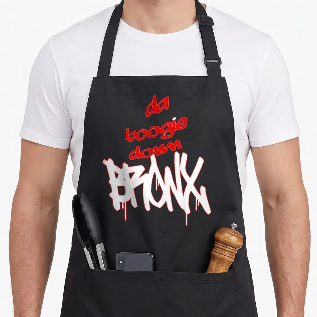 Bronx boogie new york apron - da boogie down BRONX stacked text with dripping white graffiti letters outlined in red — shown on a black cotton canvas apron against a white background
