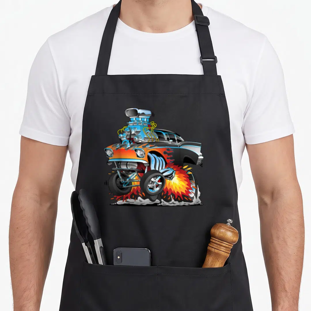 Hotrod cartoon apron - Orange and blue hot rod with large engine and rear wheel fire cartoon art — shown on a black cotton canvas apron against a white background