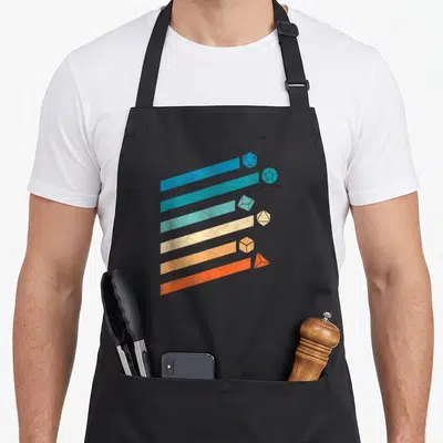 D20 game aprons - Six diagonal stripes in blue, teal, beige, orange, red ending in matching polyhedral dice — shown on a black cotton canvas apron against a white background