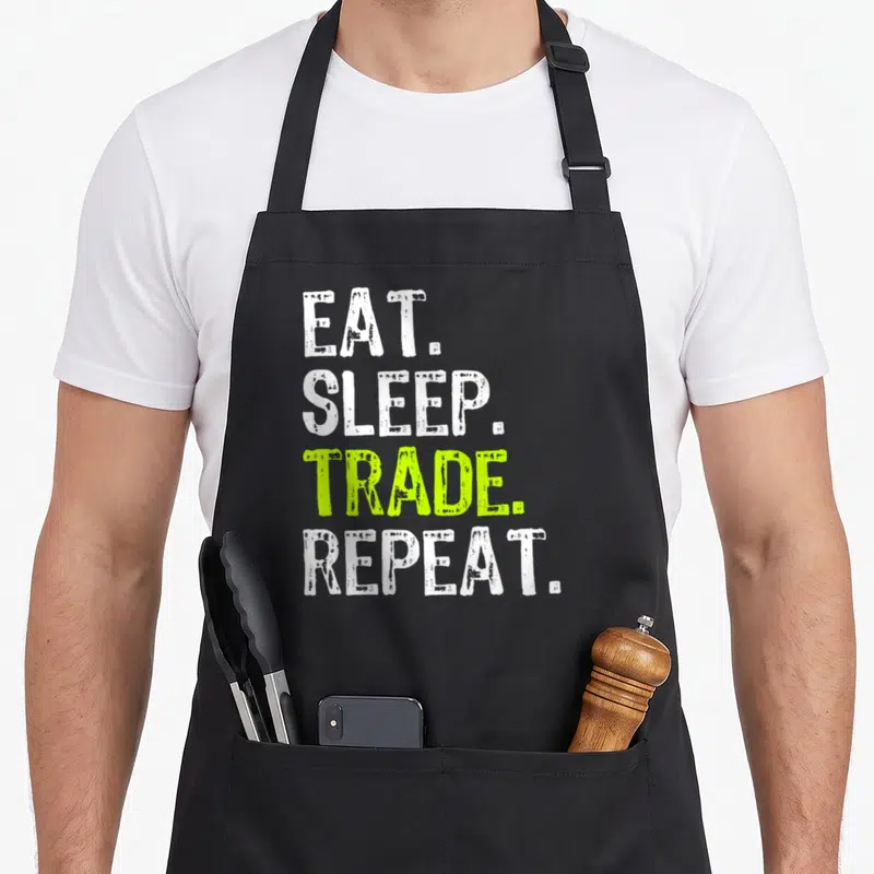 Eat stock aprons - Stacked white and lime green text reading EAT. SLEEP. TRADE. REPEAT — shown on a black cotton canvas apron against a white background