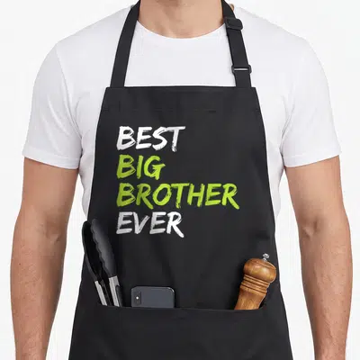Vintage brother apron - Stacked white and lime green text reading BEST BIG BROTHER EVER on black fabric — shown on a black cotton canvas apron against a white background