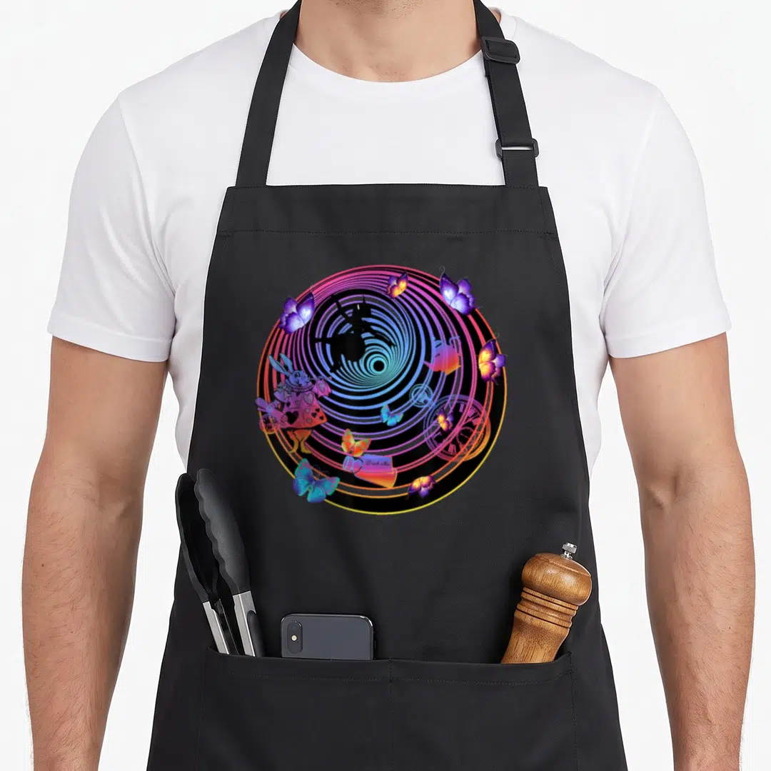 Rabbit alice wonderland apron - Multicolored spiral with rabbit, teapot, clock, butterflies, and Drink Me bottle — shown on a black cotton canvas apron against a white background