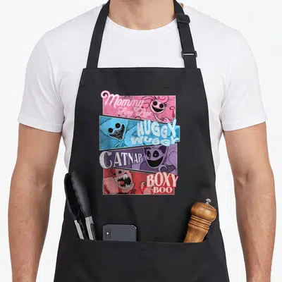 Poppy friends apron - Mommy Long Legs, Huggy Wuggy, Catnap, Boxy Boo in pink blue purple red panels — shown on a black cotton canvas apron against a white background