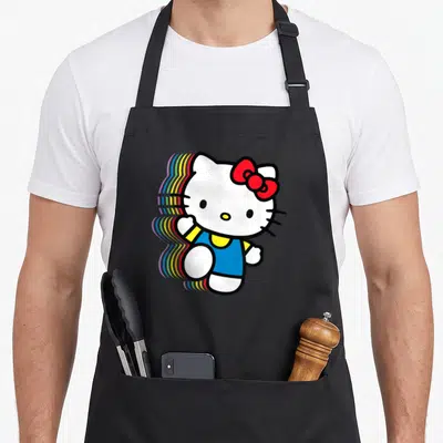 Funny rainbow apron - Cartoon cat with red bow blue shirt rainbow shadow trail left — shown on a black cotton canvas apron against a white background