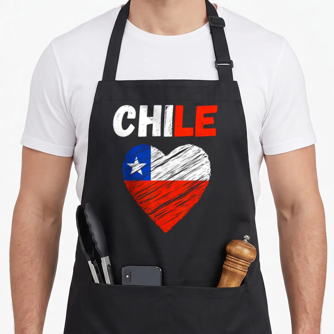 Chile holiday apron - Distressed heart filled with white red and blue flag colors below printed word CHILE — shown on a black cotton canvas apron against a white background