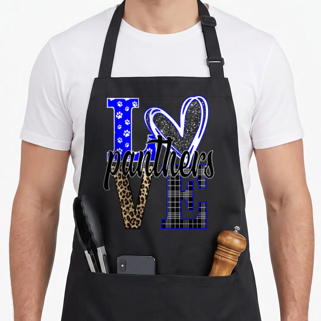 School pride apron - LOVE panthers text design with heart O, leopard print V, plaid E, and paw print L in blue and black — shown on a black cotton canvas apron against a white background
