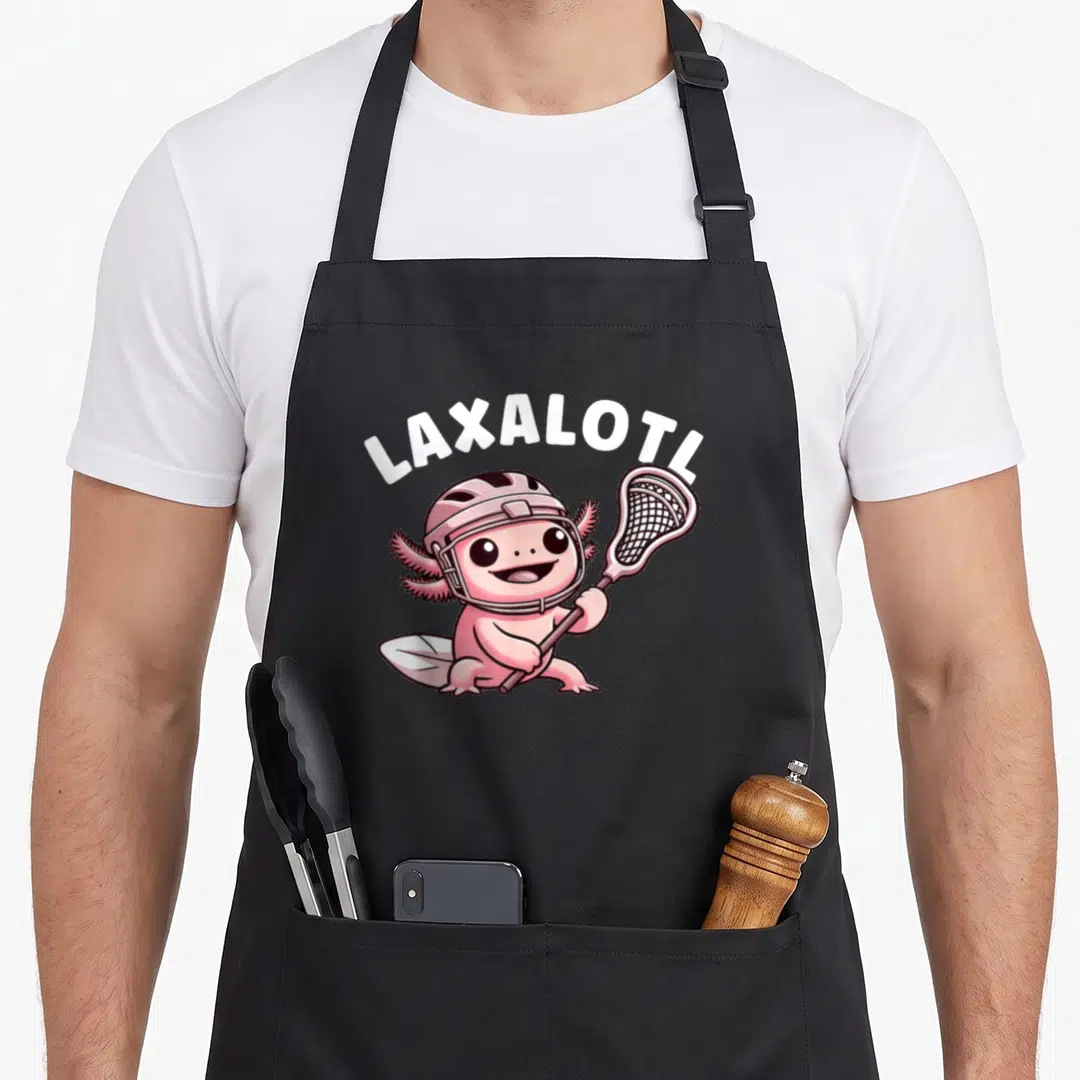 Lax lacrosse player apron - Cartoon pink axolotl in helmet holding stick under white LAXALOTL text — shown on a black cotton canvas apron against a white background