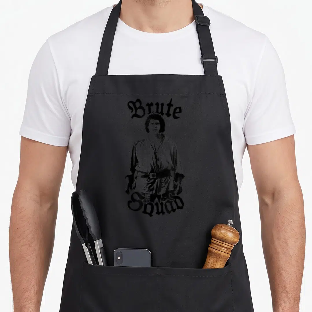 Brute princess apron - Black and white photo of man with Brute Squad text arched above and below — shown on a black cotton canvas apron against a white background