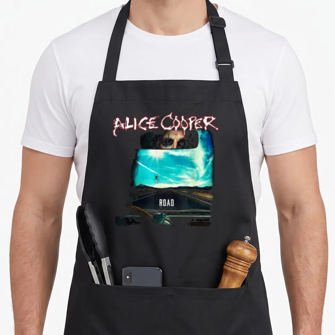 Vintage trip road apron - Alice Cooper eyes in car mirror above blue road with red spider and white text — shown on a black cotton canvas apron against a white background