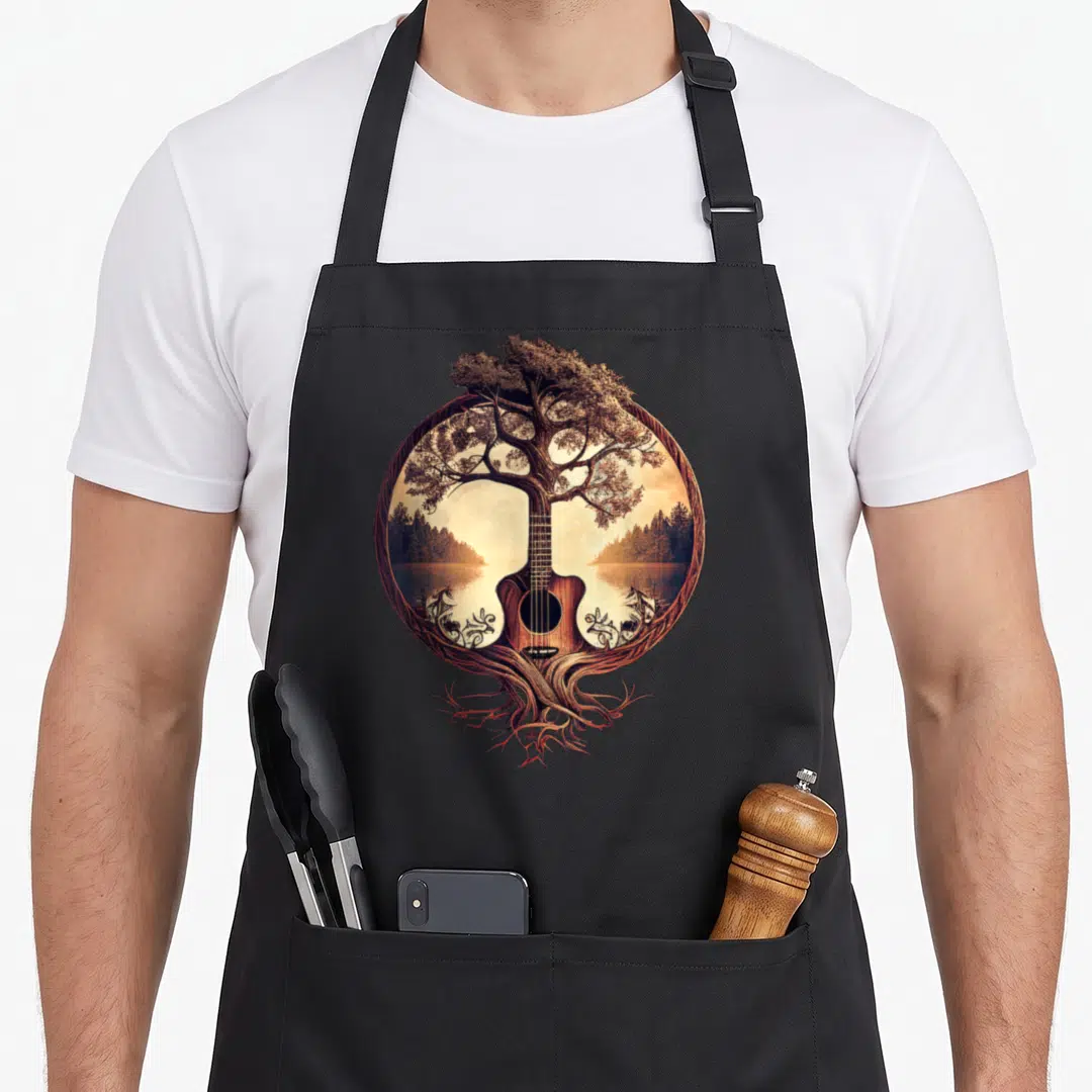 Guitar tree apron - Acoustic guitar tree shape with lake forest background in brown and tan circle — shown on a black cotton canvas apron against a white background
