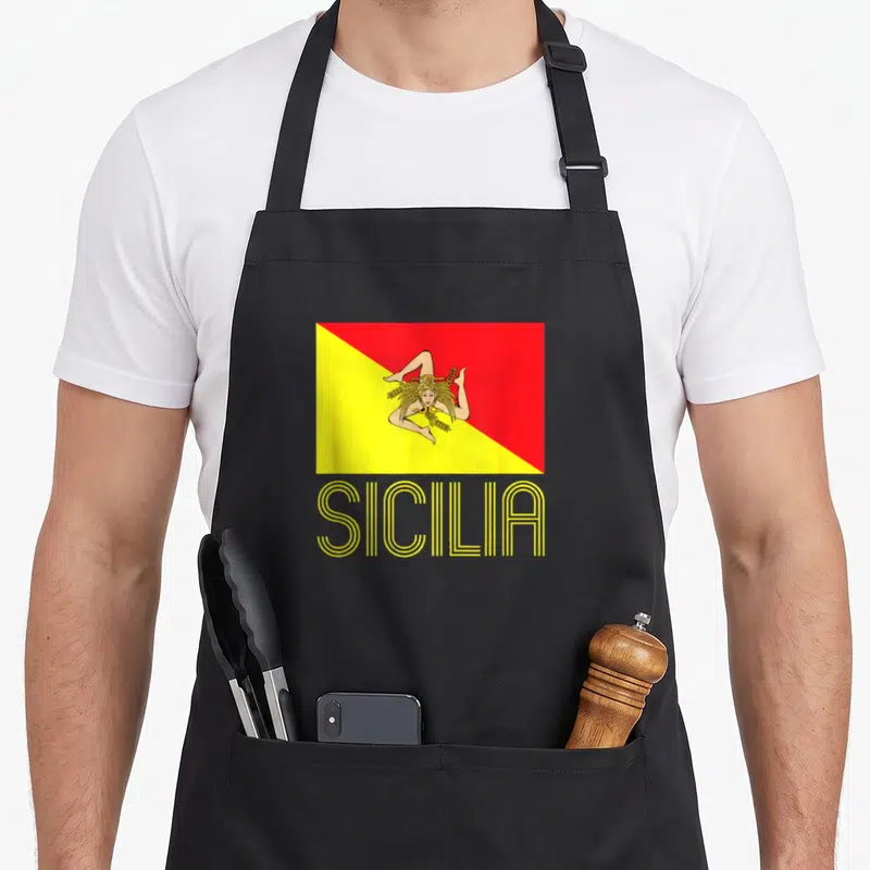 Flag sicilian apron - Red and yellow Sicily flag with linear SICILIA text below — shown on a black cotton canvas apron against a white background