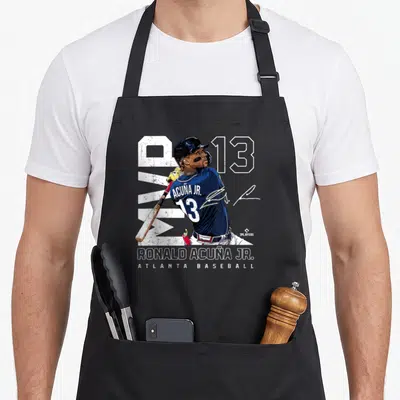 Ronald mvp apron - Ronald Acuña Jr. baseball player with number 13 and MVP text in navy and white — shown on a black cotton canvas apron against a white background