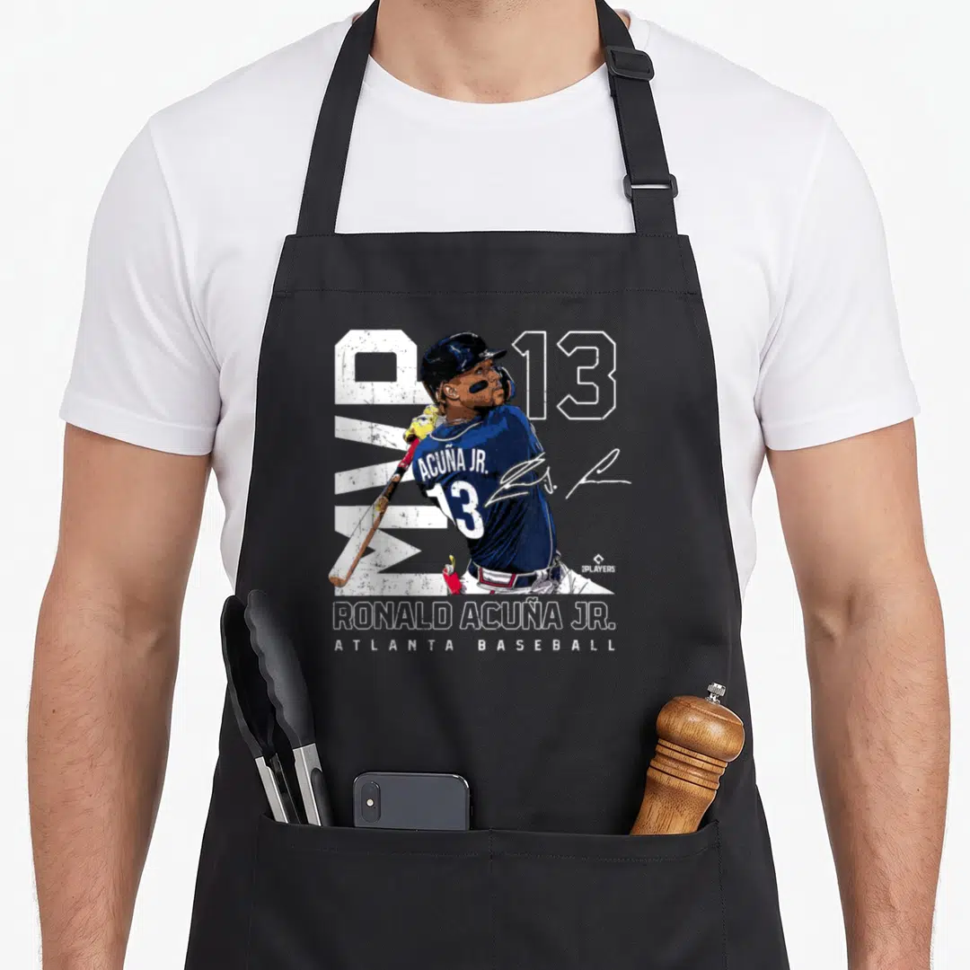 Ronald mvp apron - Ronald Acuña Jr. baseball player with number 13 and MVP text in navy and white — shown on a black cotton canvas apron against a white background