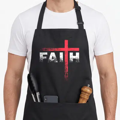 Faith cross christian aprons - Distressed white FAITH text with red cross replacing the letter I — shown on a black cotton canvas apron against a white background