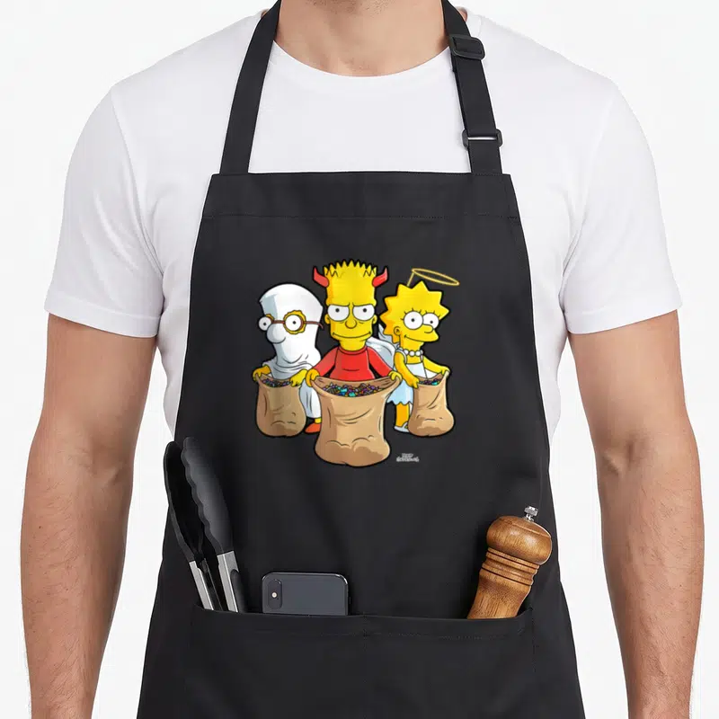 Treat treehouse halloween apron - Three cartoon children in white, red, and yellow costumes holding brown bags of candy — shown on a black cotton canvas apron against a white background