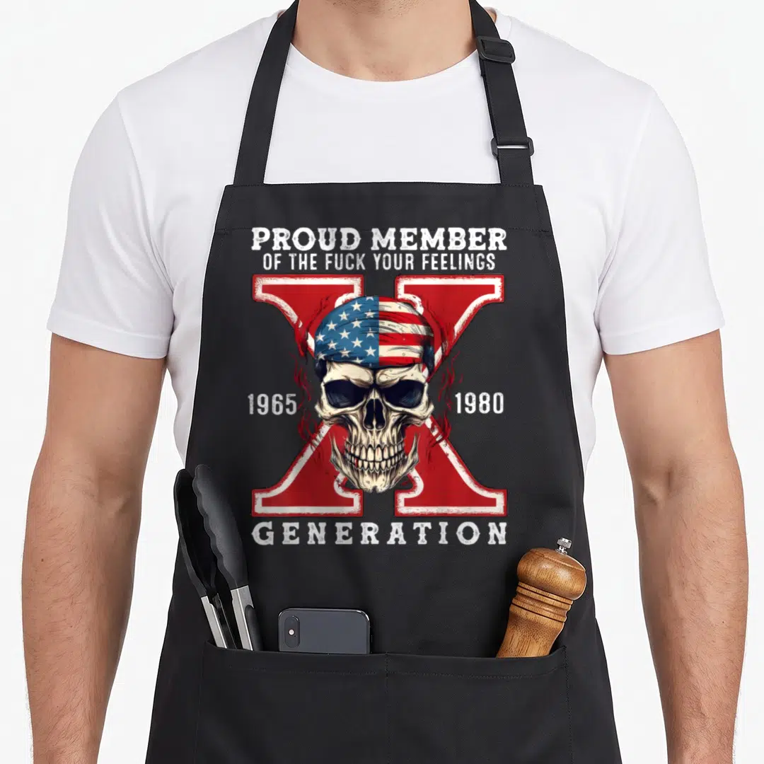 Proud skull apron - Realistic skull in US flag bandana over red X with 1965 1980 text — shown on a black cotton canvas apron against a white background