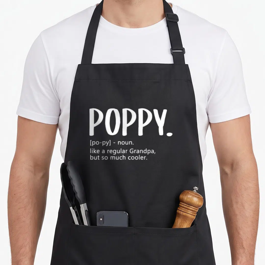 Cute poppy father day apron - White text reading POPPY like a regular Grandpa but so much cooler — shown on a black cotton canvas apron against a white background