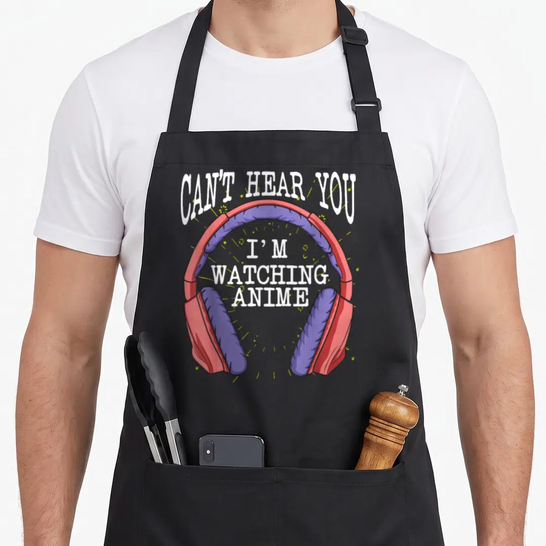 Outfit japan apron - Red purple headphones with Can't Hear You I'm Watching Anime text and yellow sparkles — shown on a black cotton canvas apron against a white background
