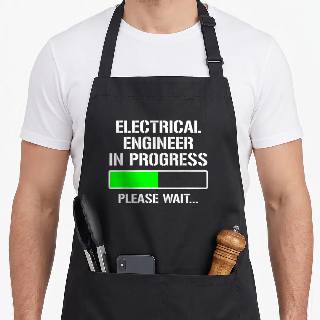 Electrical progress engineer apron - White stencil text reading electrical engineer in progress above a green loading — shown on a black cotton canvas apron against a white background