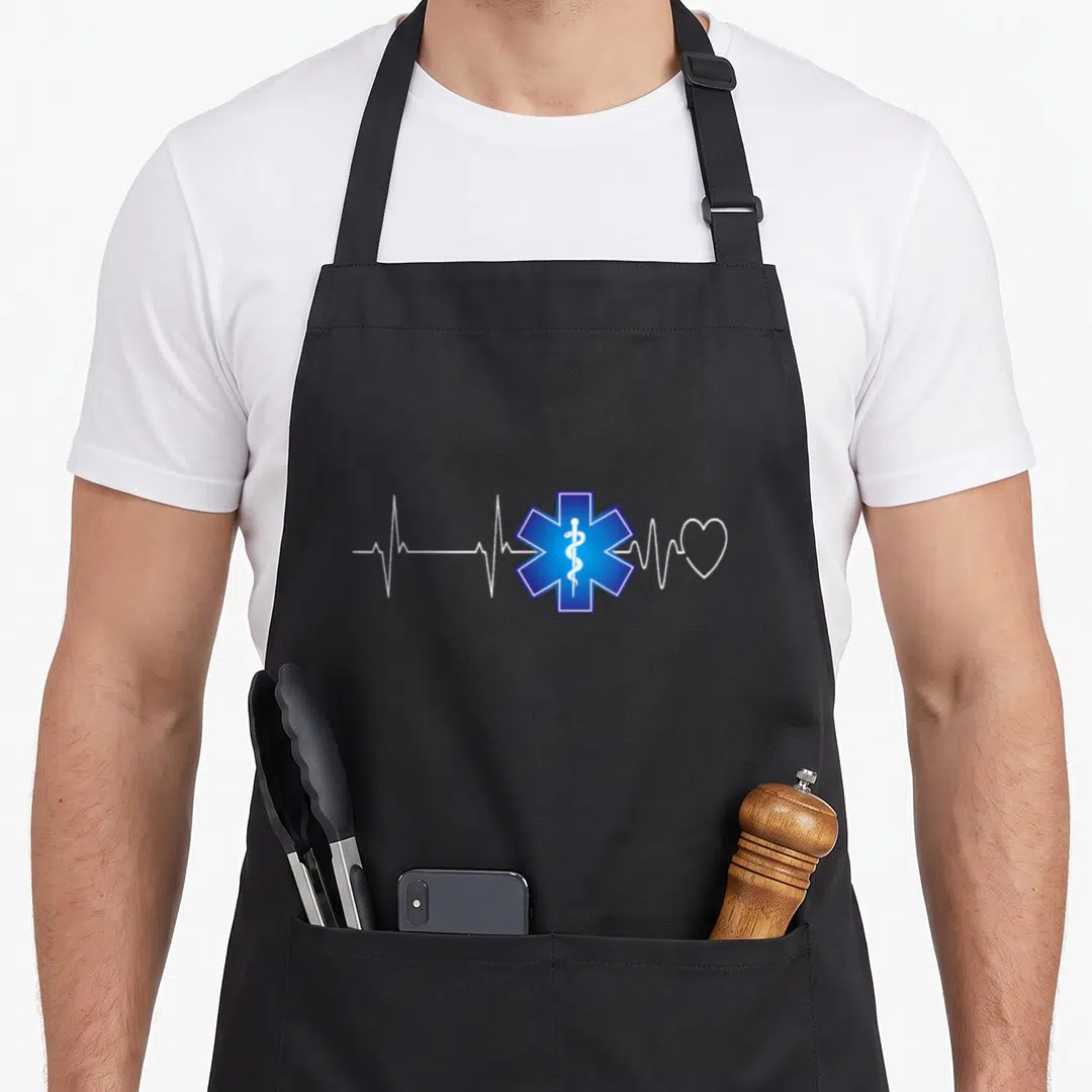Ekg emt apron - Blue Star of Life with white EKG line and heart outline, no text — shown on a black cotton canvas apron against a white background