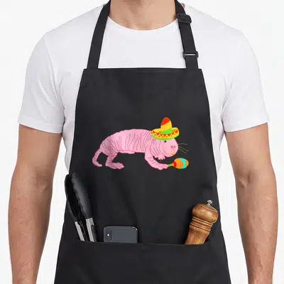 Ugly mexican apron - Pink naked mole rat wearing sombrero and holding maraca cartoon art — shown on a black cotton canvas apron against a white background