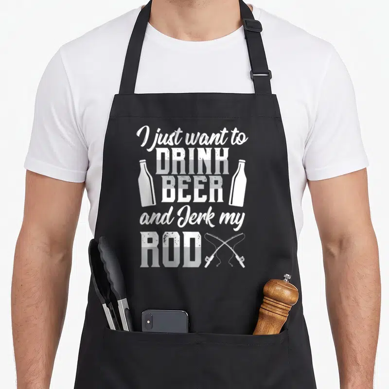 Beer fishing aprons - White stacked text I just want to drink beer and jerk my rod flanked by bottles and crossed rods — shown on a black cotton canvas apron against a white background