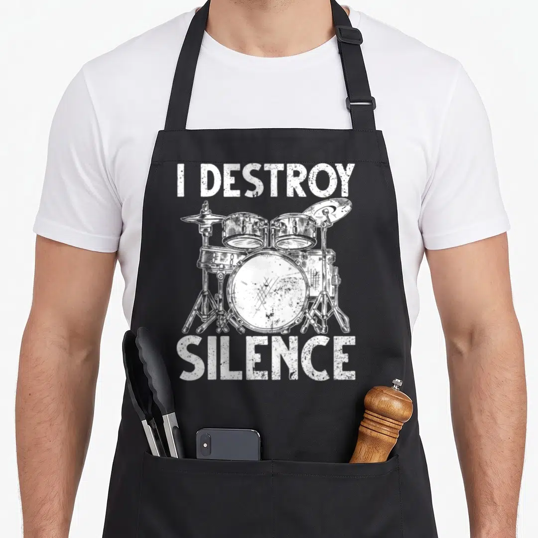 Rocker drum apron - White distressed I DESTROY SILENCE text surrounding a sketched drum kit — shown on a black cotton canvas apron against a white background