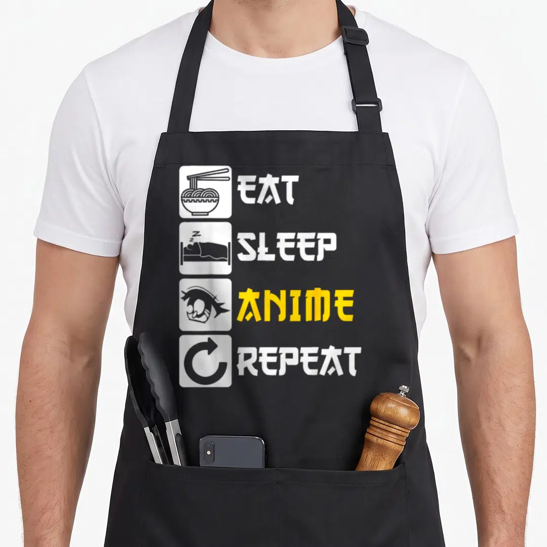 Eat japan apron - Stacked white icons of noodles, sleeping person, anime head, and arrow next to stylized text — shown on a black cotton canvas apron against a white background