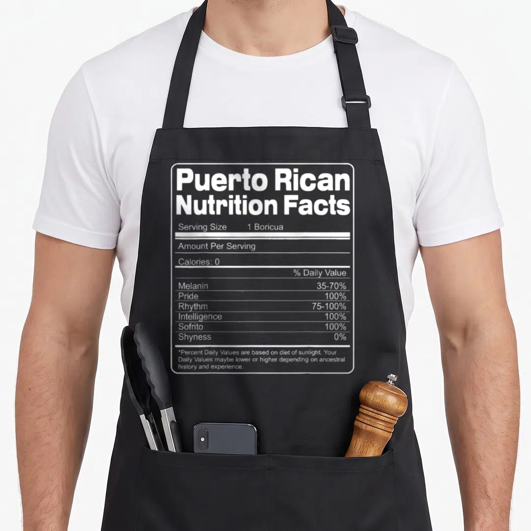 Nutrition rican apron - White nutrition facts label listing 1 Boricua serving size, 100% Pride, Rhythm, and Sofrito — shown on a black cotton canvas apron against a white background