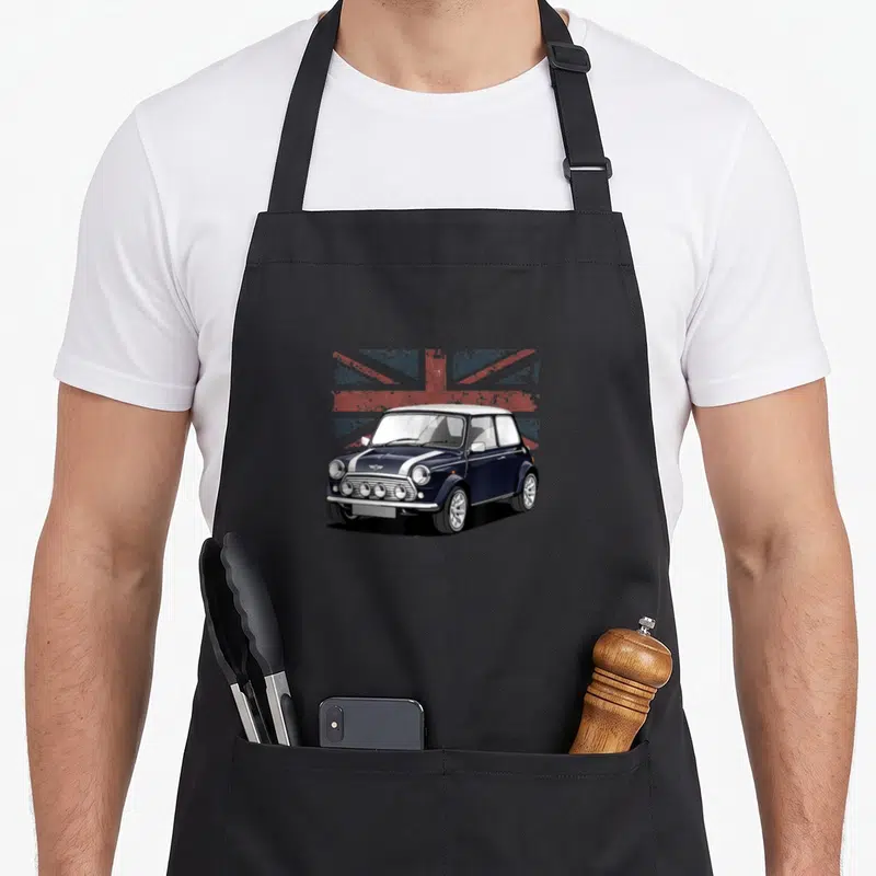 Sport flag car apron - Realistic dark blue classic car over distressed red white and blue flag — shown on a black cotton canvas apron against a white background