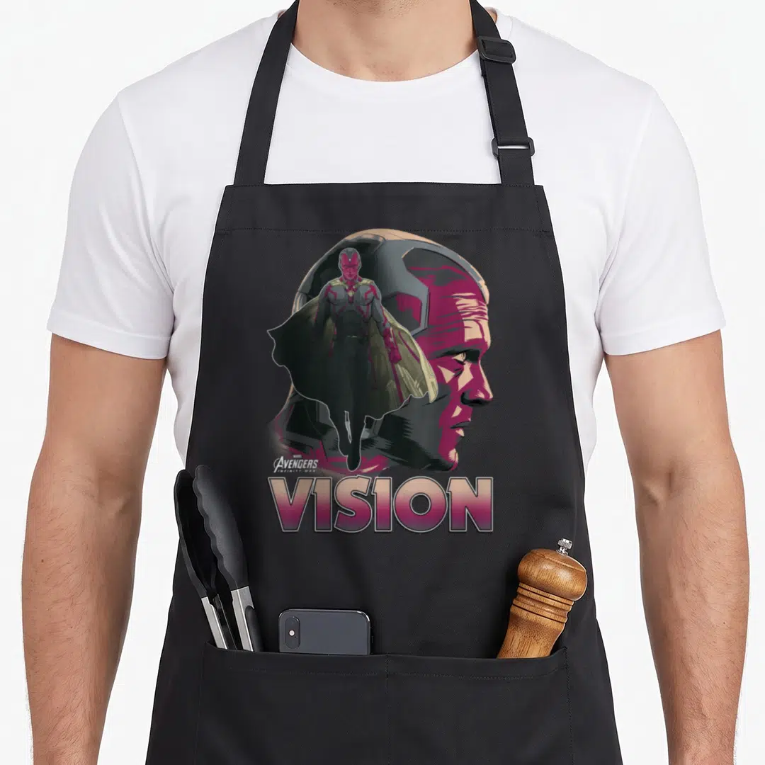 Vision infinity apron - Profile head of Vision with full-body figure and VISION text in purple grey gold — shown on a black cotton canvas apron against a white background