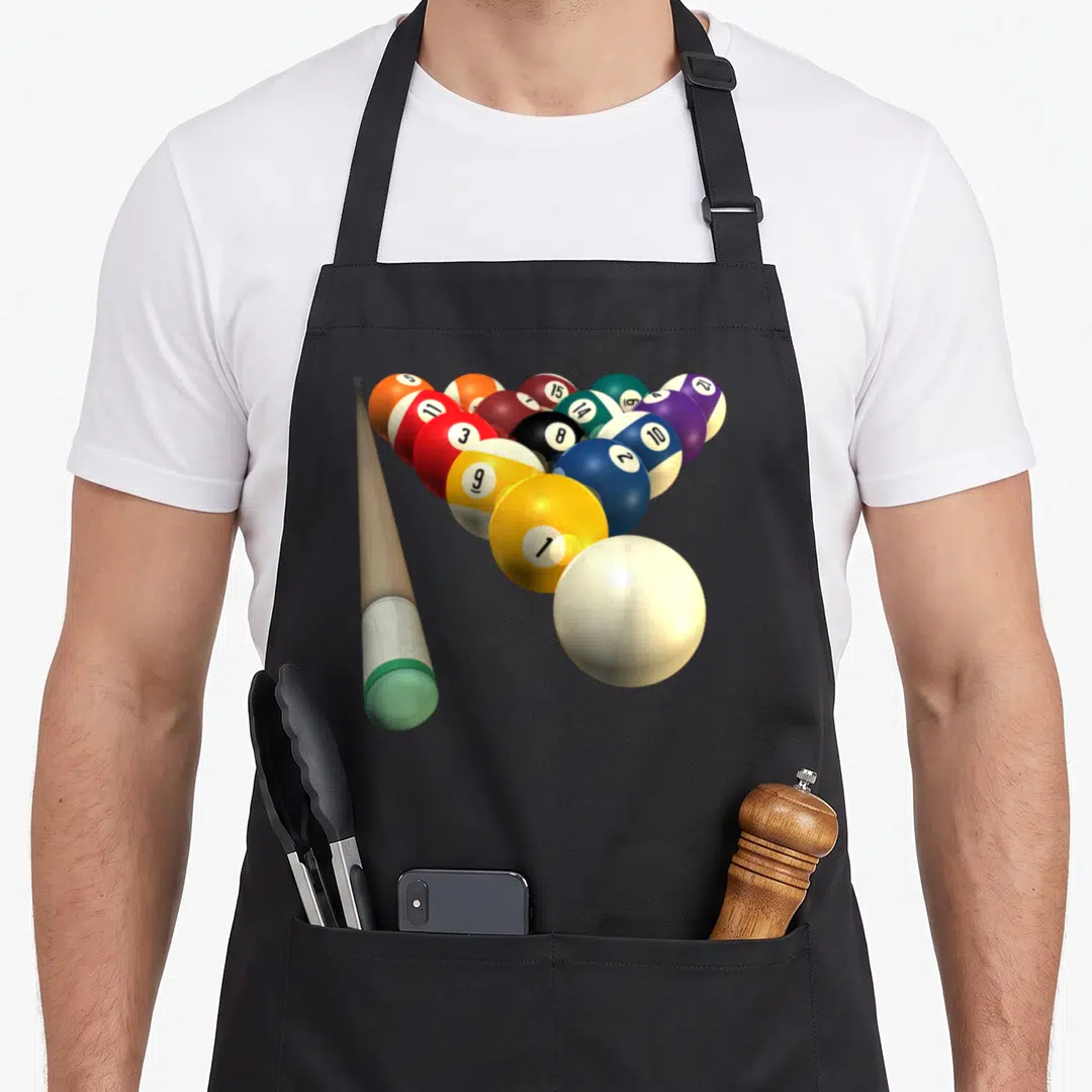 Ball billiards apron - Realistic cue stick pointing at clustered billiard balls numbered 1 to 15 in yellow, blue, red — shown on a black cotton canvas apron against a white background