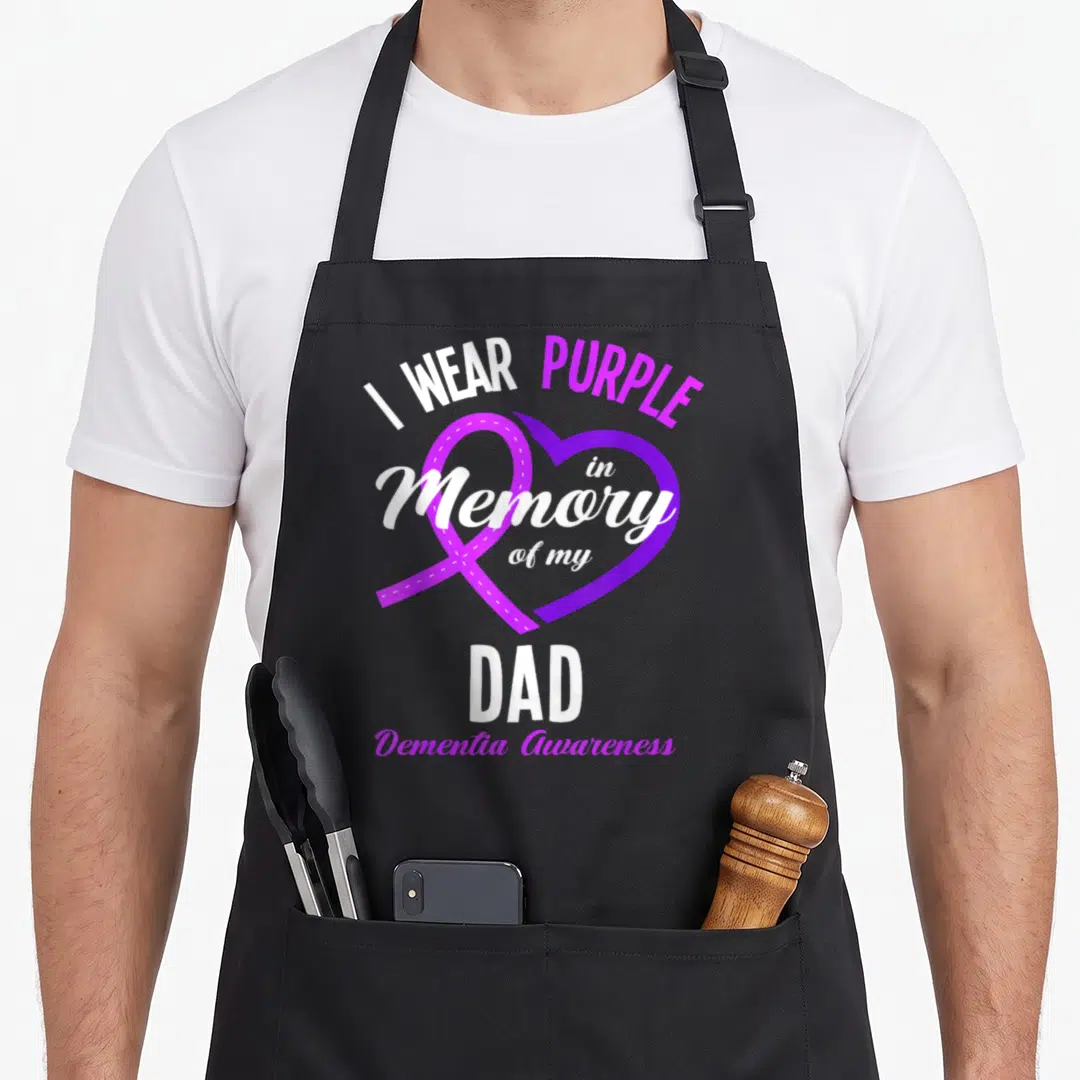 Dementia memory apron - Purple heart ribbon with I WEAR PURPLE in Memory of my DAD Dementia Awareness text — shown on a black cotton canvas apron against a white background