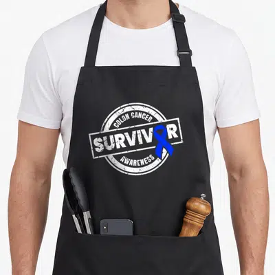 Colon cancer girl apron - Distressed stamp design with blue ribbon and white text reading Colon Cancer Survivor — shown on a black cotton canvas apron against a white background
