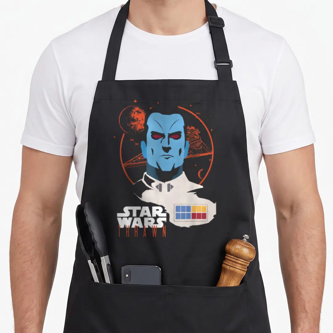 Admiral x apron - Minimalist blue Thrawn bust with orange circle, planet, ship, and STAR WARS THRAWN text — shown on a black cotton canvas apron against a white background