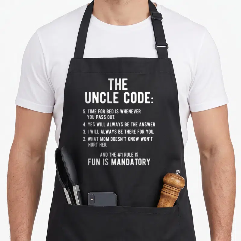 Niece funcle apron - White typography listing The Uncle Code rules including fun is mandatory and what mom doesnt know — shown on a black cotton canvas apron against a white background