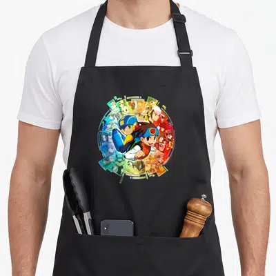 Mega collection apron - Circular cartoon collage of characters in blue red yellow green digital shards — shown on a black cotton canvas apron against a white background