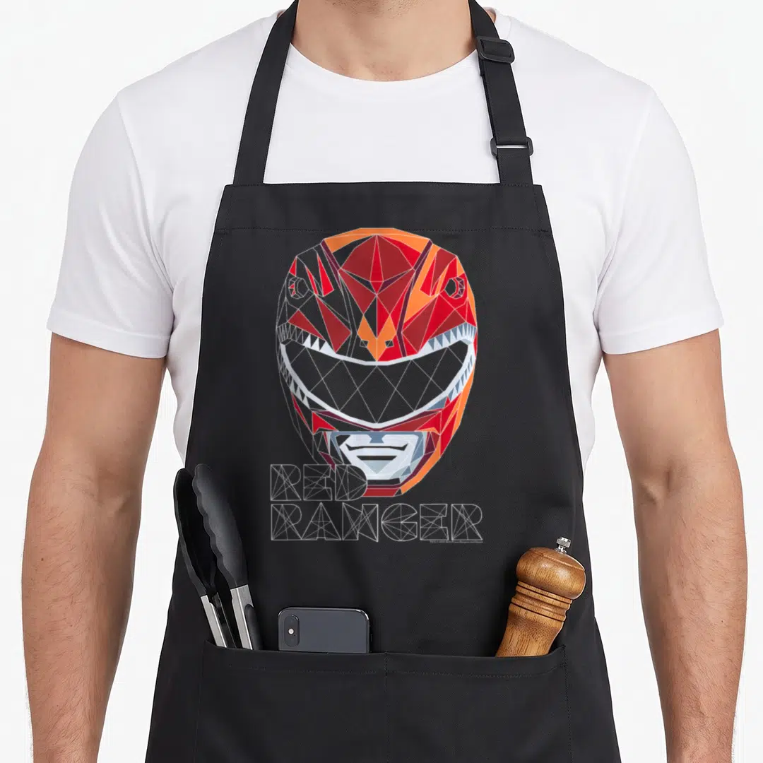 Geometric face apron - Low poly red ranger helmet with wireframe text in red orange white grey — shown on a black cotton canvas apron against a white background