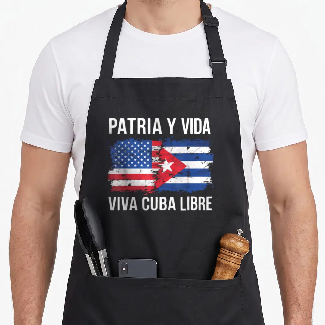 Cuban country american flag apron - Merged US and Cuba flags with PATRIA Y VIDA text in distressed white red and blue — shown on a black cotton canvas apron against a white background