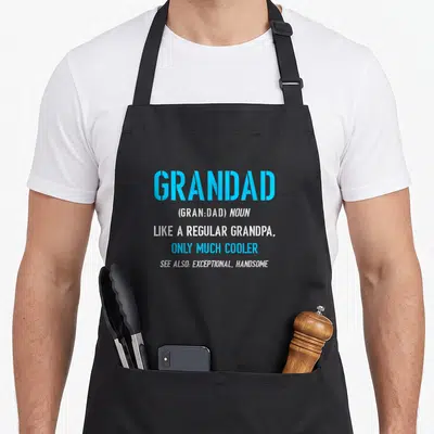 Definition grandad aprons - Light blue and white dictionary definition text reading Grandad Like A Regular Grandpa Only — shown on a black cotton canvas apron against a white background