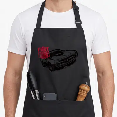 Fast muscle apron - Black and white muscle car drawing with red distressed FAST FURIOUS text overlay — shown on a black cotton canvas apron against a white background