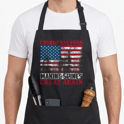 Chiropractic chiropractor husband apron - Distressed USA flag with chiropractors making spines great again text in red — shown on a black cotton canvas apron against a white background
