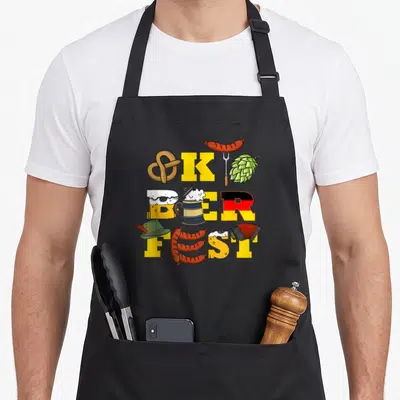 Costume german apron - Oktoberfest text formed by pretzel beer mug sausages and accordion in yellow cartoon style — shown on a black cotton canvas apron against a white background
