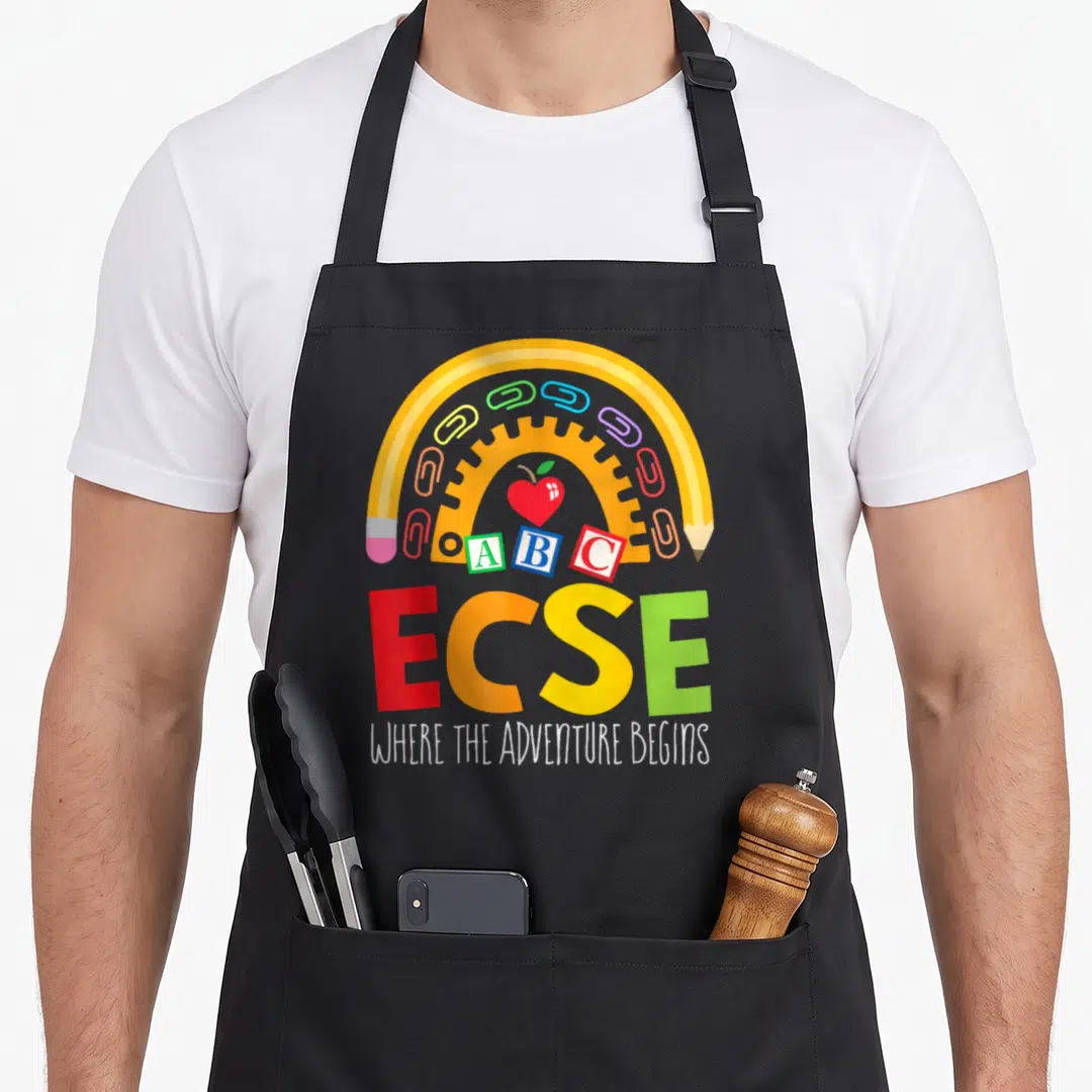 Early special aprons - Yellow pencil arch over red apple, ABC blocks, paperclips, and ECSE text — shown on a black cotton canvas apron against a white background