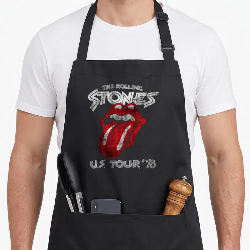 Cool tour rolling stones apron - Distressed red mouth logo with arched text reading THE ROLLING STONES and U.S. TOUR — shown on a black cotton canvas apron against a white background