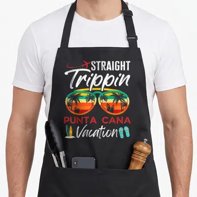 Straight couple apron - Retro sunglasses with palm tree reflection and straight trippin text — shown on a black cotton canvas apron against a white background