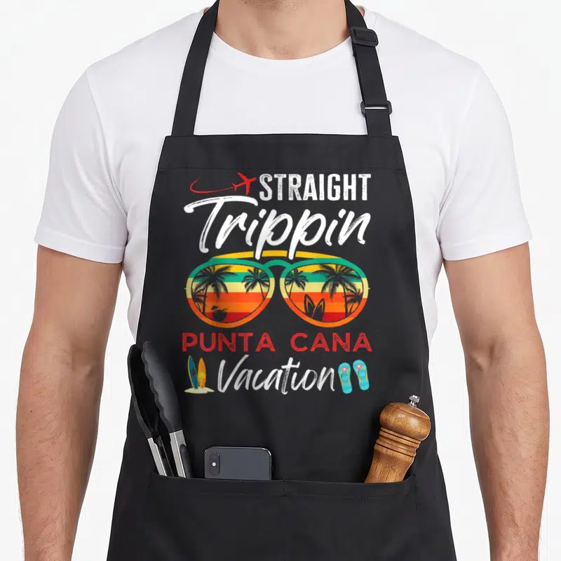 Straight couple apron - Retro sunglasses with palm tree reflection and straight trippin text — shown on a black cotton canvas apron against a white background