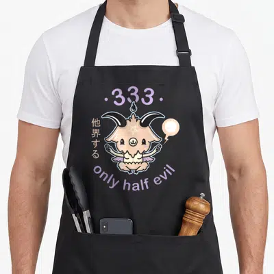 Evil goth apron - Beige demon creature with purple text only half evil and Japanese characters — shown on a black cotton canvas apron against a white background