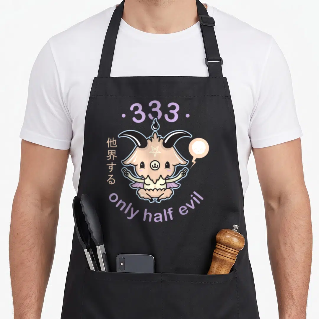 Evil goth apron - Beige demon creature with purple text only half evil and Japanese characters — shown on a black cotton canvas apron against a white background