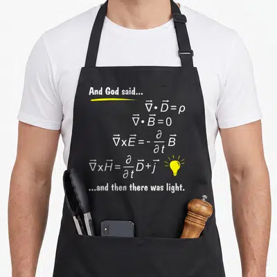 God physicist apron - White Maxwell equations text with yellow underline and light bulb icon — shown on a black cotton canvas apron against a white background